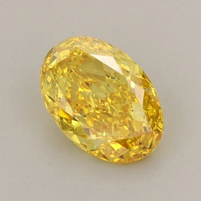 0.73 ct. Fancy Vivid Yellow/VS1 Oval Lab Grown Diamond
