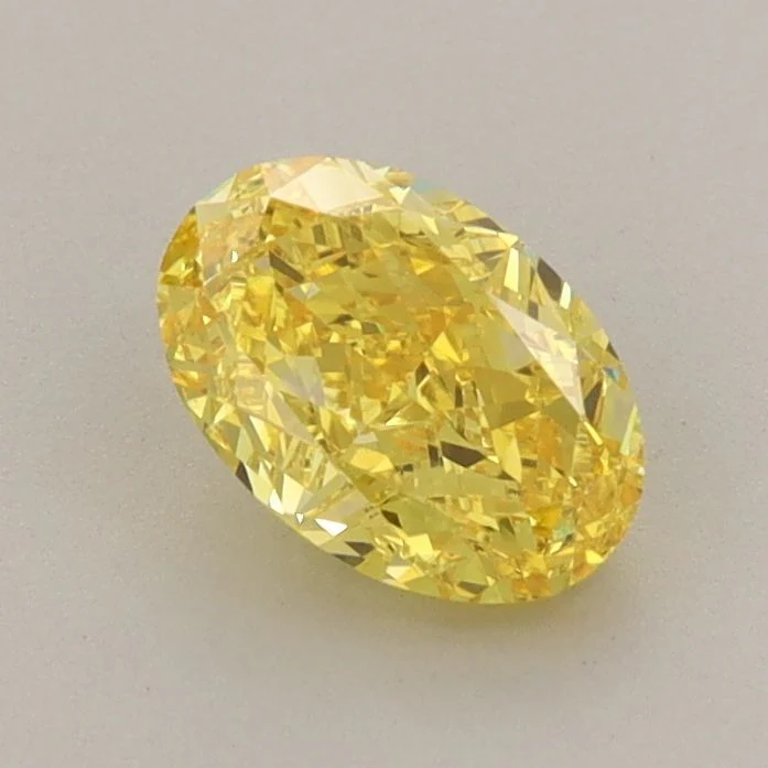0.94 ct. Fancy Vivid Yellow/VVS2 Oval Lab Grown Diamond